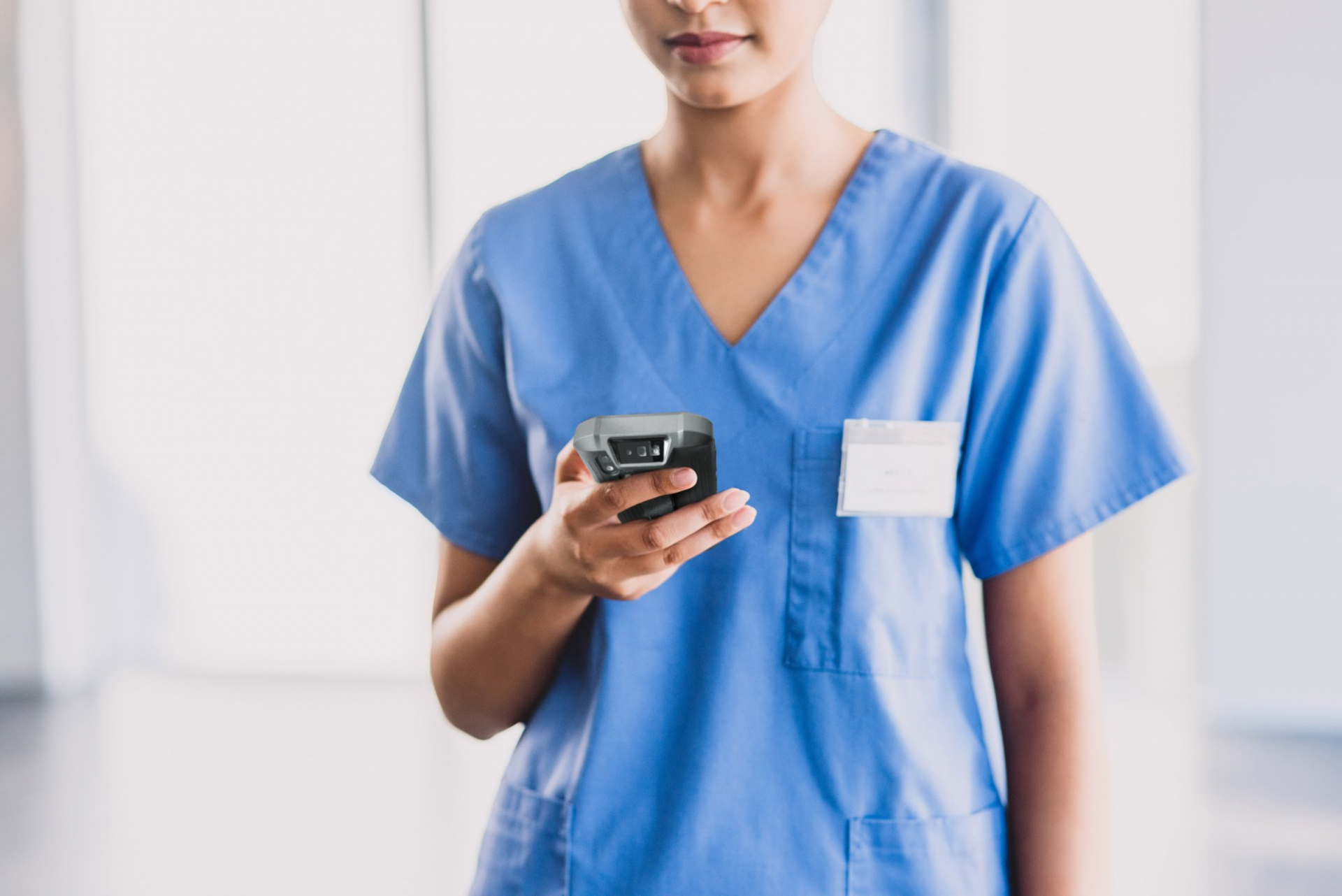 Hospital Employee holding MT93 Megattera Mobile Computer for barcode scanning on the go.